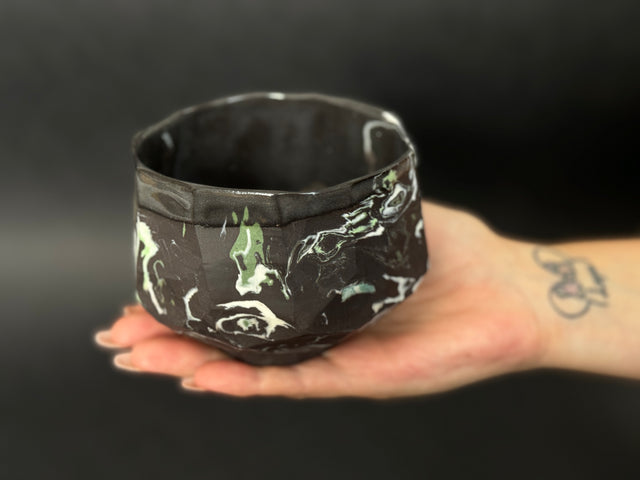 Black, white and green porcelain tea bowl; chawan