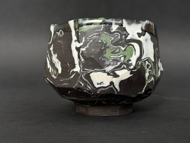 Black, white and green porcelain tea bowl; chawan