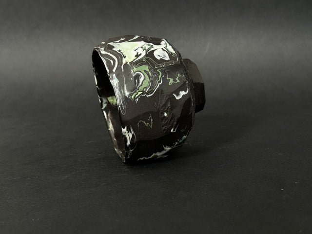 Black, white and green porcelain tea bowl; chawan