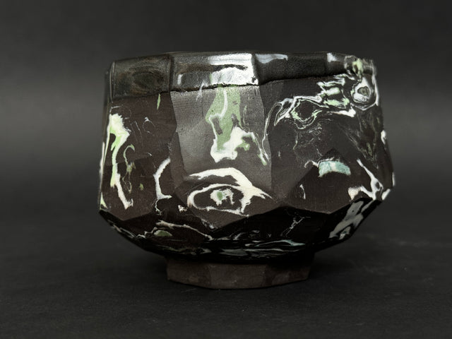 Black, white and green porcelain tea bowl; chawan