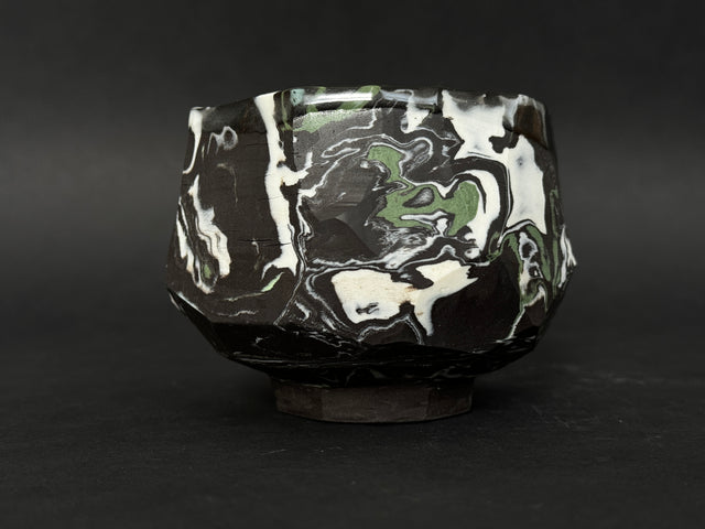 Black, white and green porcelain tea bowl; chawan